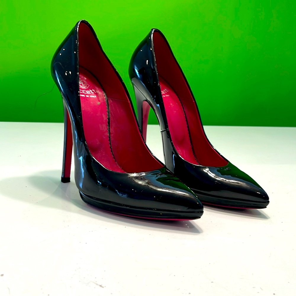 Sky high leather heels with loop for pompom or charm on front. Pink soles.